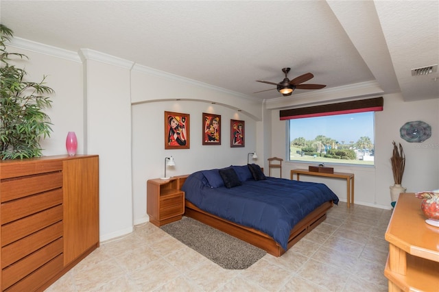 bedroom featuring a textured ceiling, ceiling fan, and crown molding