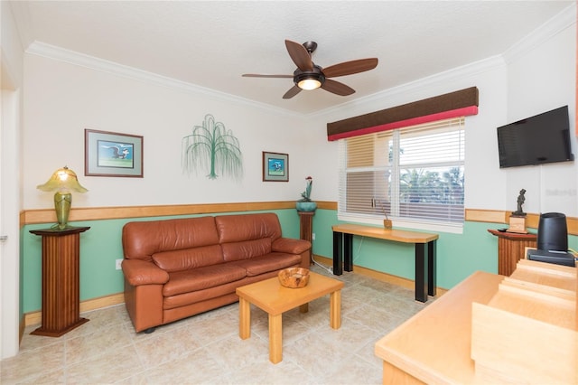 living room featuring ceiling fan and crown molding