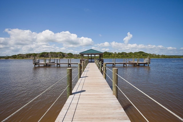 dock area featuring a gazebo and a water view