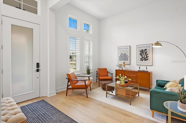 living area with light hardwood / wood-style flooring