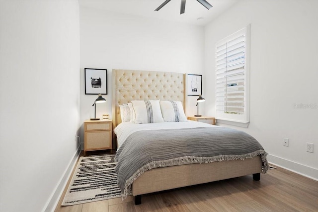 bedroom featuring wood-type flooring and ceiling fan