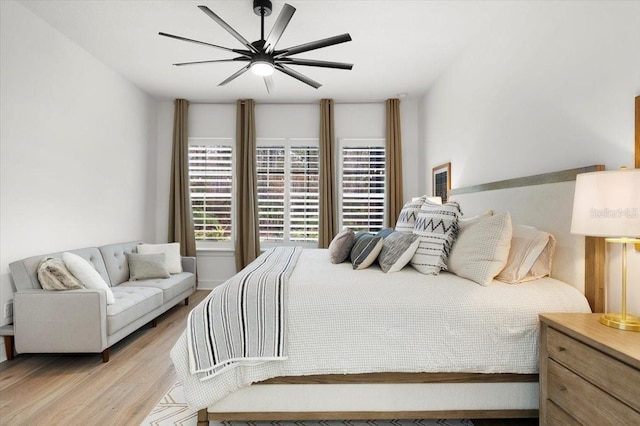 bedroom featuring ceiling fan and light wood-type flooring