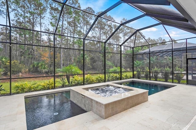 view of pool with a patio and glass enclosure