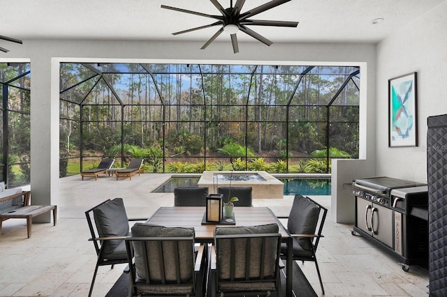 view of patio / terrace featuring an outdoor kitchen, ceiling fan, and a pool with hot tub