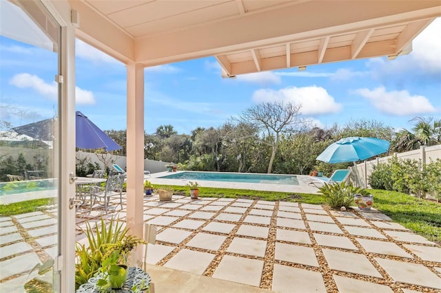 view of patio featuring a fenced in pool