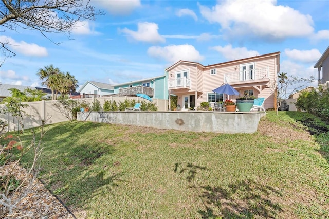 view of yard featuring a balcony