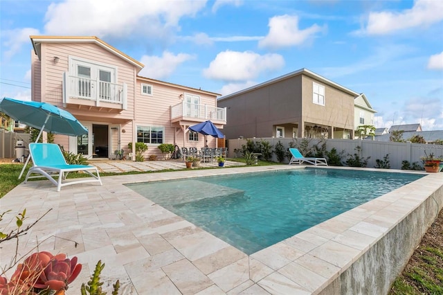 view of pool featuring a patio