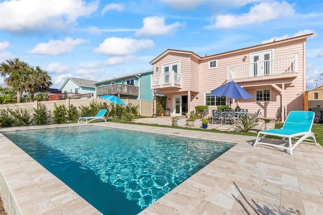 view of swimming pool featuring a patio area