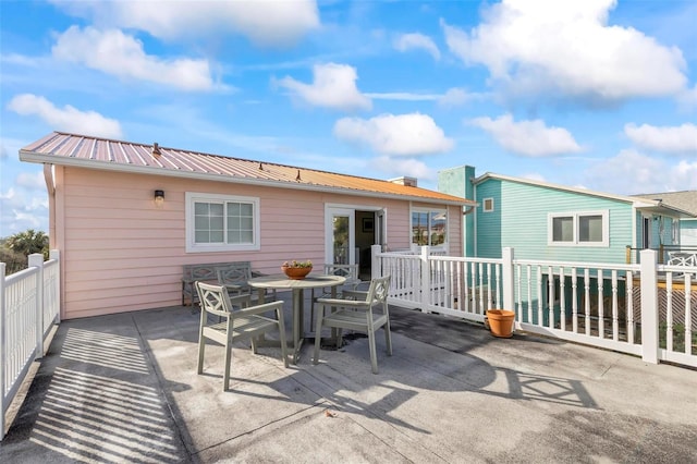 rear view of property featuring a patio area