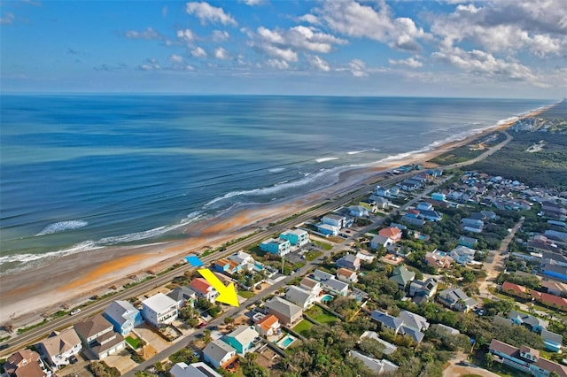 aerial view featuring a water view and a view of the beach