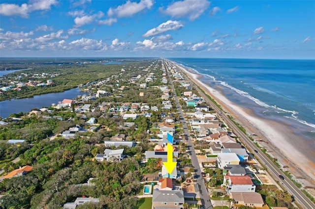 birds eye view of property featuring a view of the beach and a water view