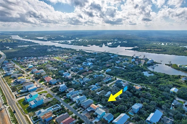 drone / aerial view with a water view