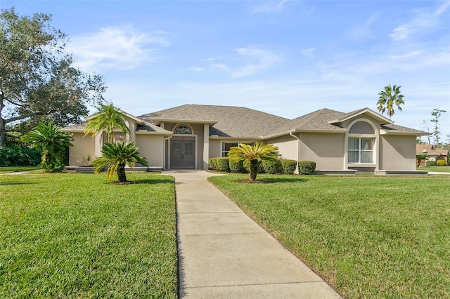 ranch-style house with a front lawn