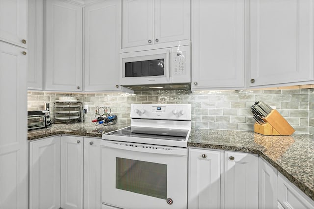 kitchen featuring white appliances, backsplash, and white cabinets