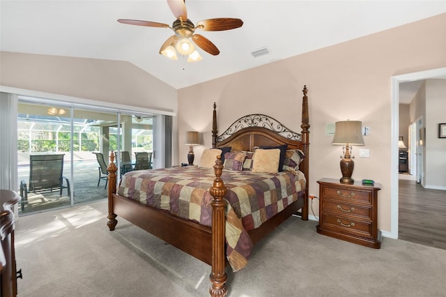 carpeted bedroom with vaulted ceiling, ceiling fan, and access to exterior