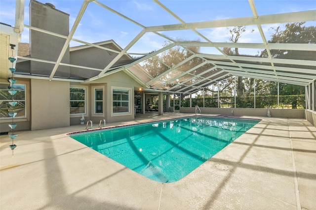 view of pool featuring a lanai and a patio area