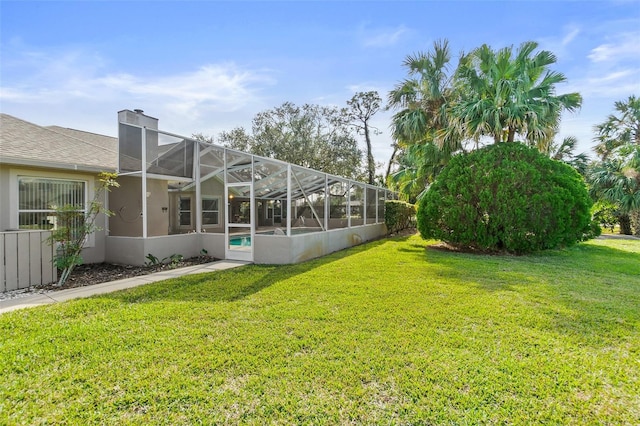 view of yard with a lanai