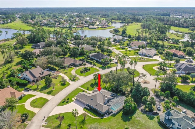 birds eye view of property with a water view