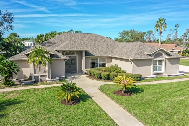 ranch-style house featuring a front yard