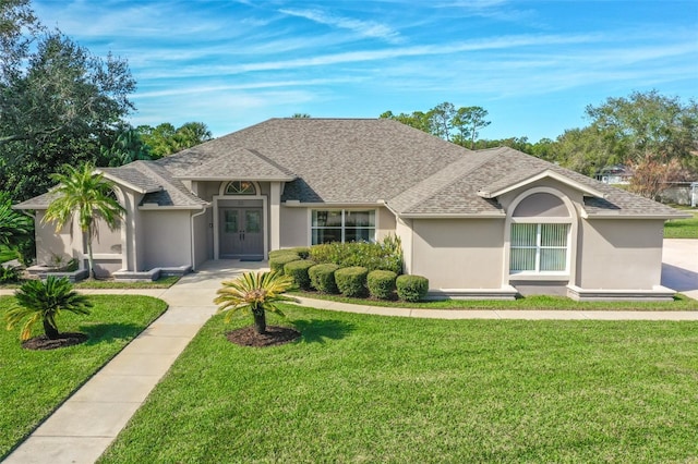 single story home featuring a front yard