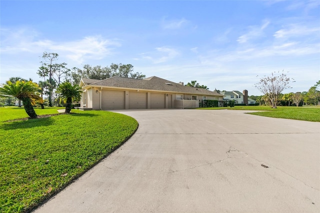 ranch-style home with a front lawn and a garage