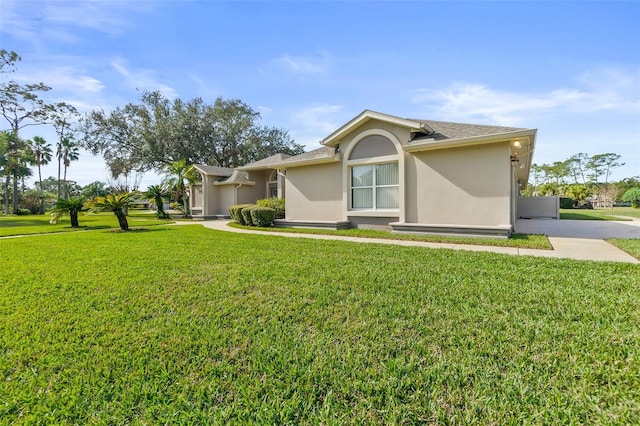 ranch-style home with a front yard