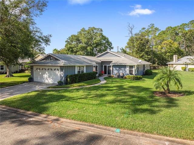 ranch-style house with a garage and a front yard