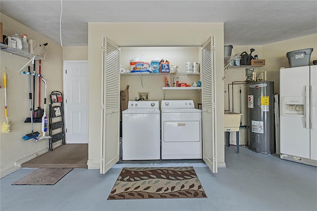 laundry room featuring washer and clothes dryer and water heater