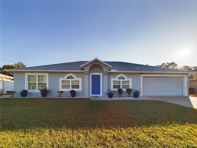 ranch-style house featuring a front lawn and a garage