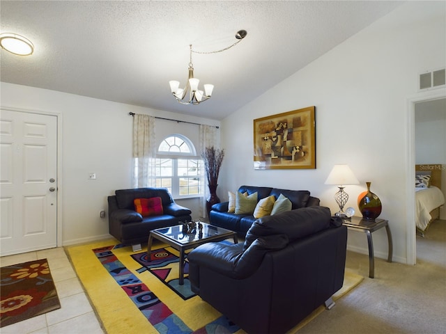 living area featuring visible vents, an inviting chandelier, vaulted ceiling, a textured ceiling, and light tile patterned flooring