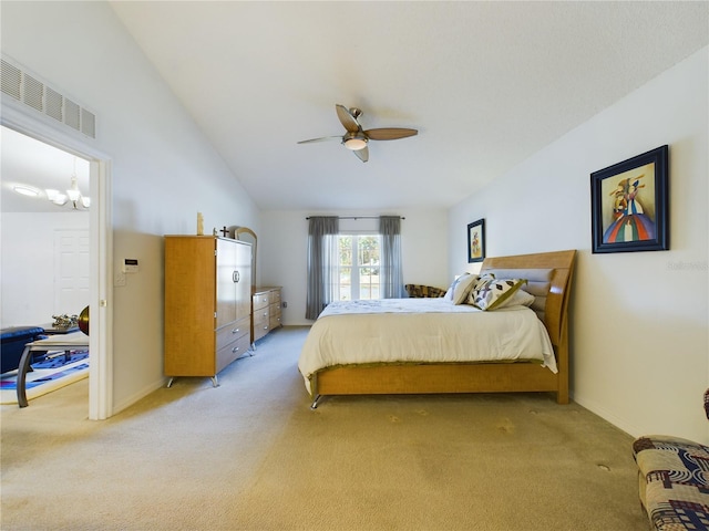 bedroom featuring light colored carpet, visible vents, and lofted ceiling