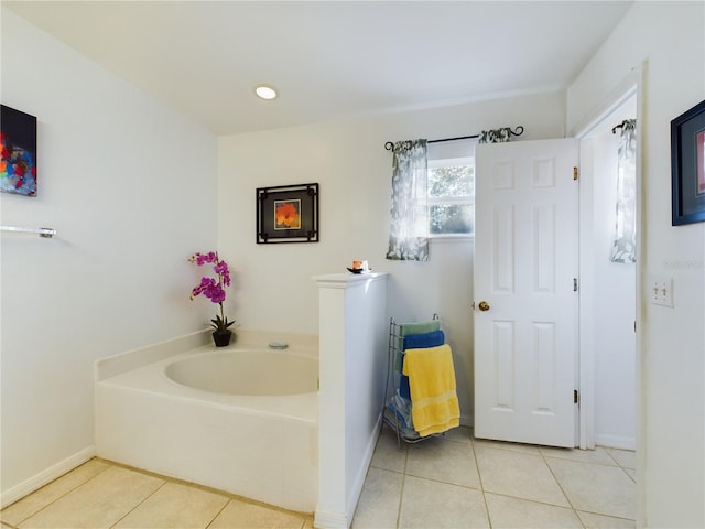 bathroom featuring tile patterned flooring, recessed lighting, baseboards, and a bath