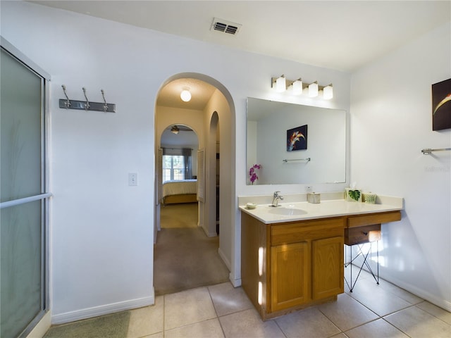 bathroom with visible vents, connected bathroom, vanity, and tile patterned floors