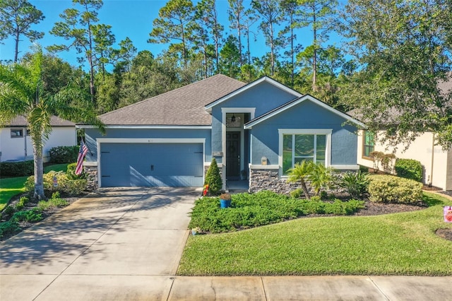 view of front of property featuring a front lawn and a garage