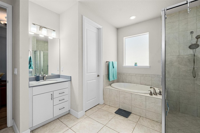 bathroom with vanity, tile patterned floors, and independent shower and bath