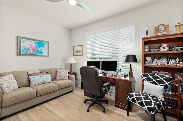 home office featuring ceiling fan and light hardwood / wood-style flooring