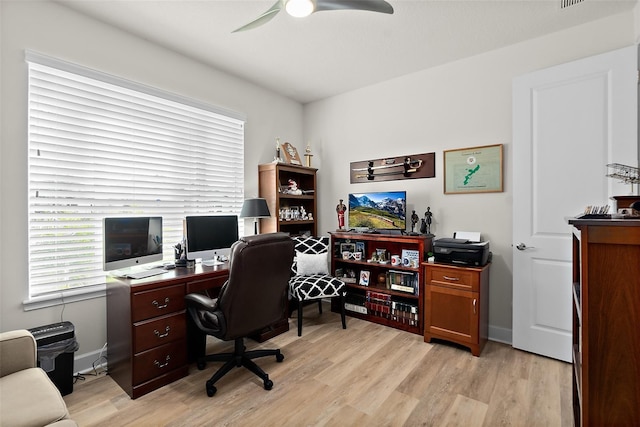 office with ceiling fan and light hardwood / wood-style floors