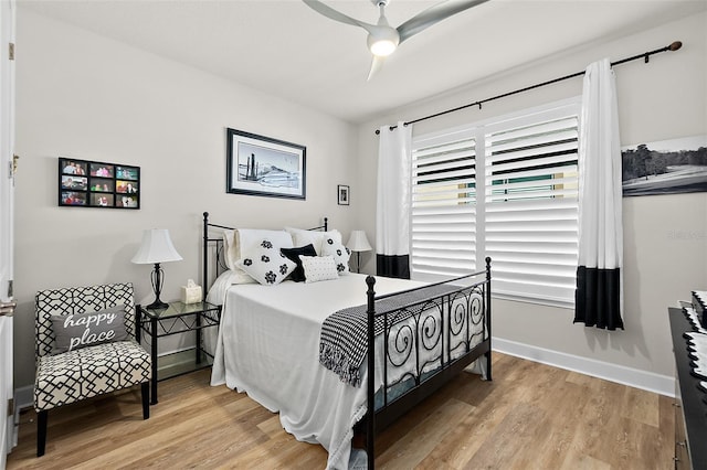 bedroom featuring ceiling fan and light hardwood / wood-style flooring