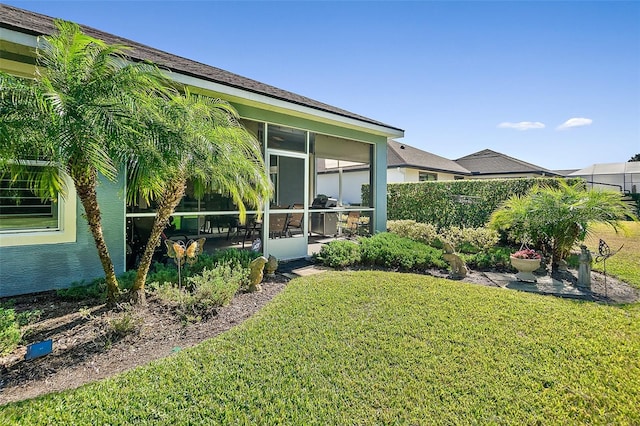 view of yard featuring a sunroom