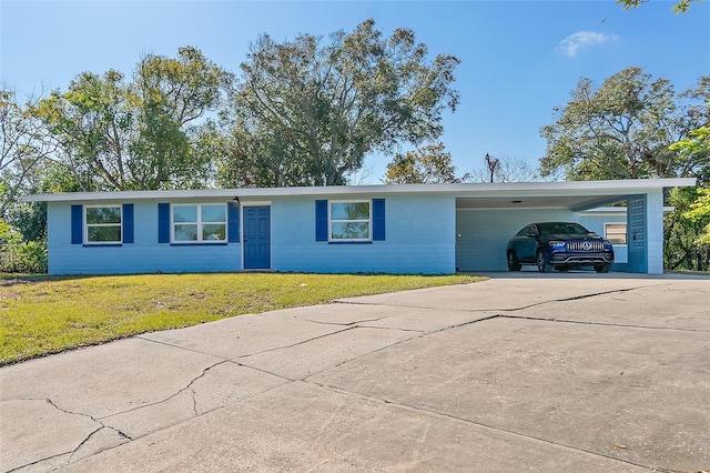 ranch-style house with a front lawn and a carport