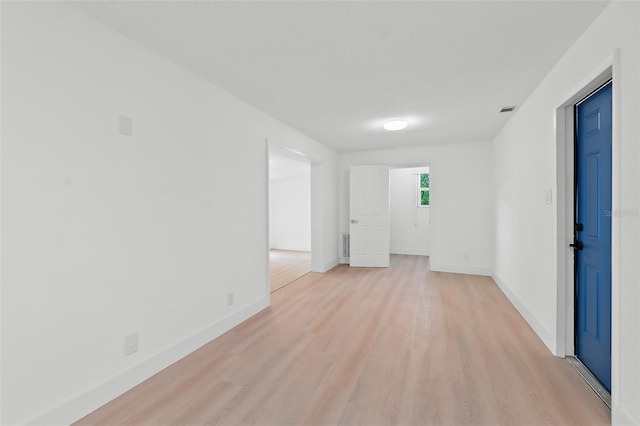 unfurnished room featuring light hardwood / wood-style flooring