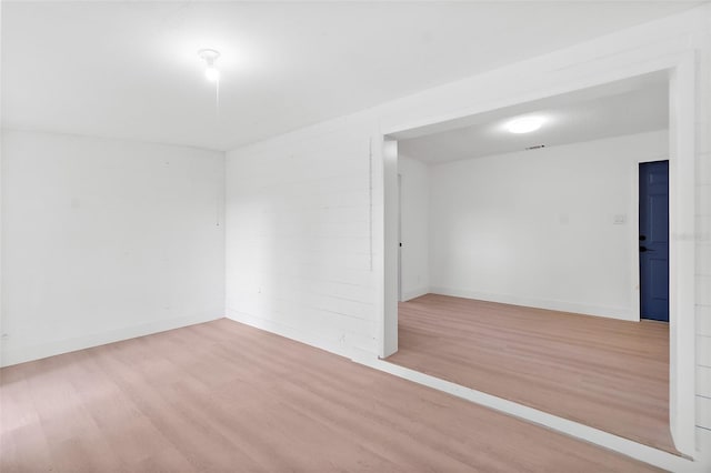 spare room featuring light hardwood / wood-style flooring