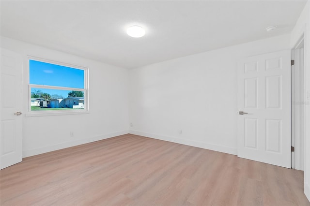 unfurnished room with light hardwood / wood-style flooring