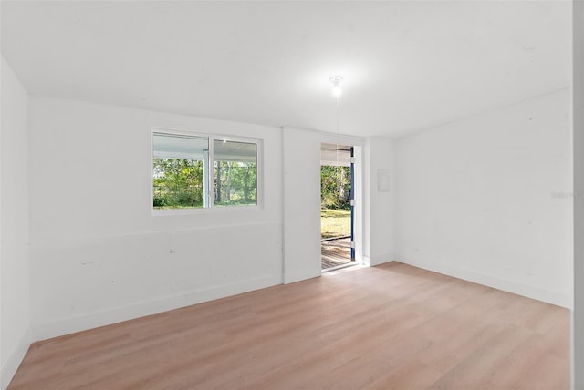 spare room with light wood-type flooring