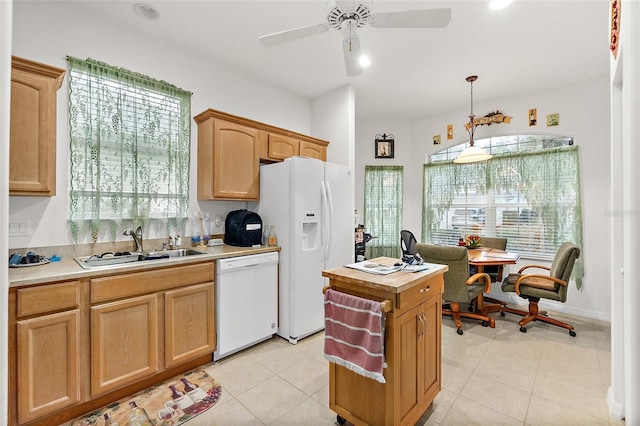 kitchen with ceiling fan, sink, decorative light fixtures, white appliances, and light tile patterned floors