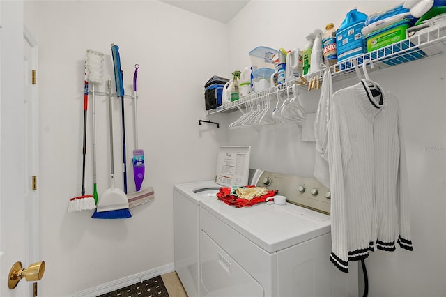 clothes washing area with separate washer and dryer