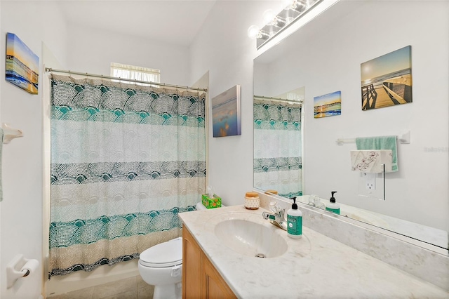 bathroom with tile patterned flooring, a shower with curtain, vanity, and toilet