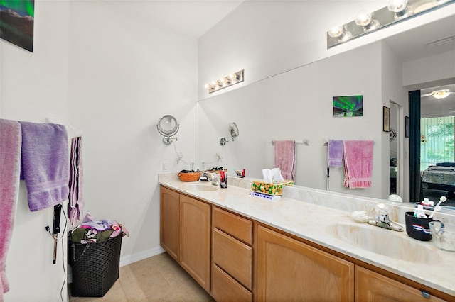 bathroom with tile patterned flooring and vanity