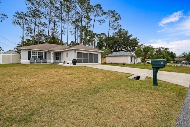 single story home featuring a front yard and a garage