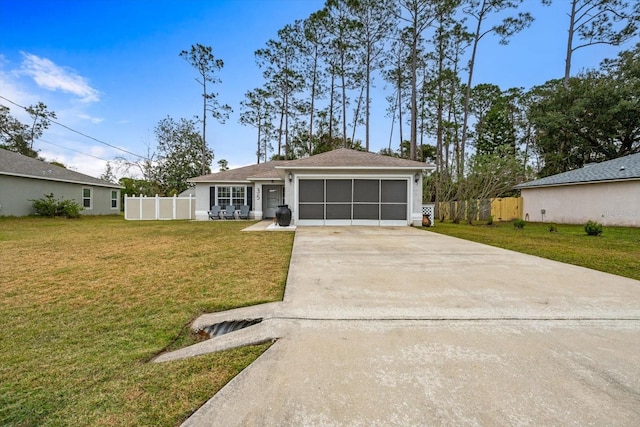 ranch-style home featuring a garage and a front lawn